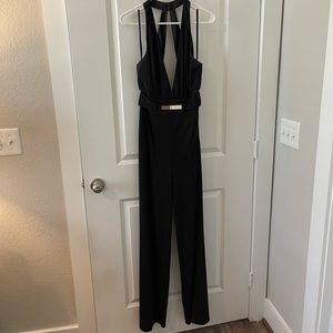 Bebe Sexy Halter Jumpsuit, black, size 8, with gold detail, gently worn